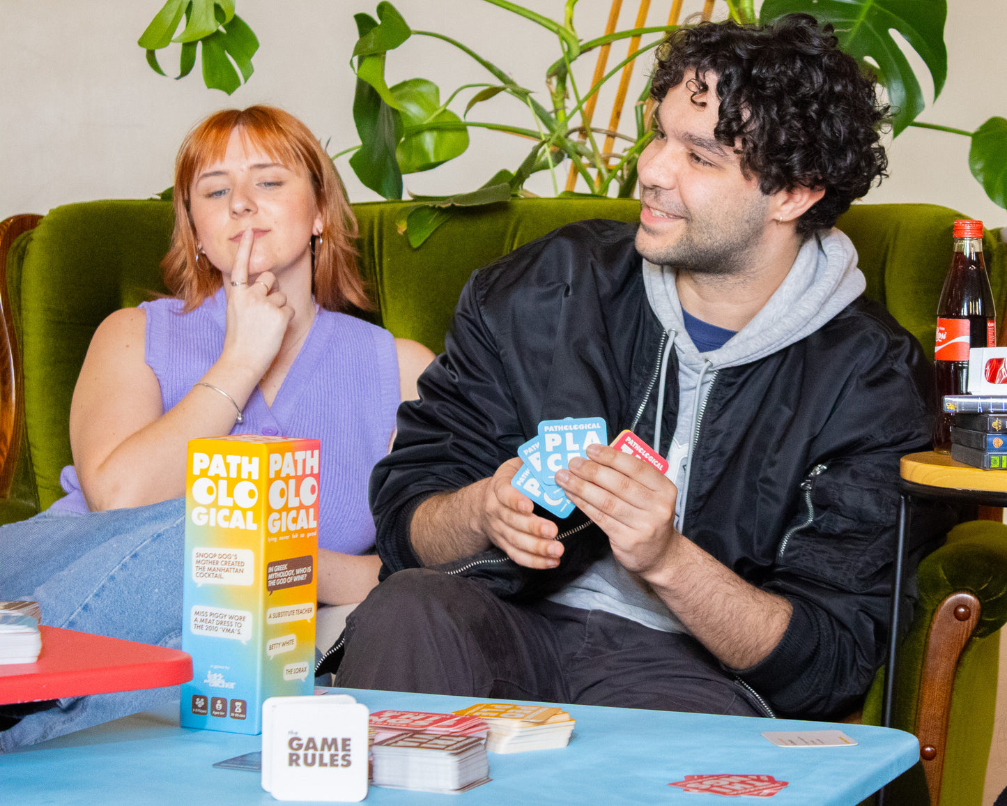 Friends and Family Playing Pathological Party Trivia Card Board Game